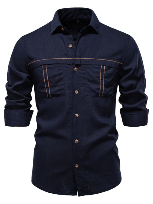 Long-sleeved button-down shirt with a collar and chest pockets.